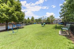 Johns Creek apartment for rent - a large grassy park with benches and a playground