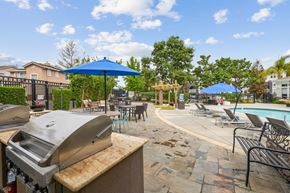 Cupertino apartment for rent - our apartments have a resort style pool and dining area with umbrellas