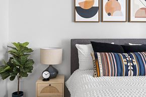 Lyndhurst apartment for rent - a bedroom with a bed and a clock on a night stand