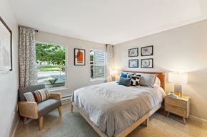 Everett apartment for rent - a bedroom with a large bed and a window