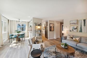 Everett apartment for rent - a living room and dining room with a couch and a table