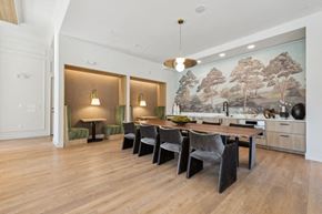 Gaithersburg apartment for rent - a dining room with a table and chairs and a painting on the wall