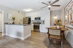 Moorpark apartment for rent - a kitchen and dining room with a table and a ceiling fan