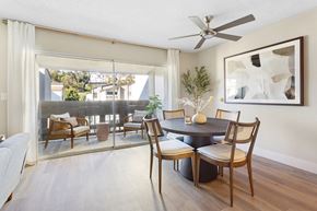Los Angeles apartment for rent - a dining room with a table and chairs and a ceiling fan