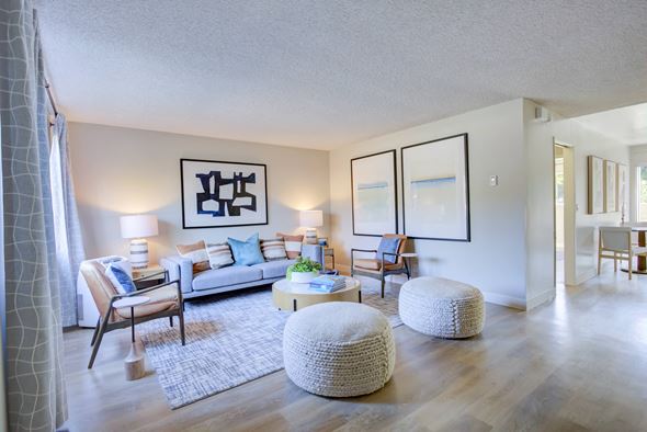 Camarillo apartment for rent - a spacious living room with white walls and hardwood flooring