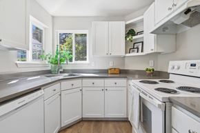 Beaverton apartment for rent - a white kitchen with white appliances and white cabinets