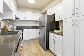 Los Angeles apartment for rent - a large kitchen with stainless steel appliances and white cabinets