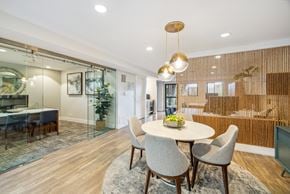 Mill Valley apartment for rent - A modern leasing office with a glass table and chairs.