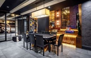 Brooklyn apartment for rent - A modern dining room with a black table and chairs.