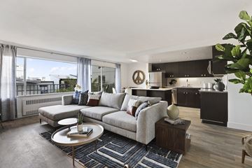 Seattle apartment for rent - a living room with a couch and a table