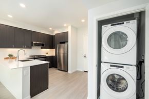 Mountain View apartment for rent - a washer and dryer in a living room with a kitchen