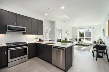 Mountain View apartment for rent - an open kitchen and living room with a table and chairs