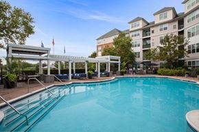 Lyndhurst apartment for rent - a swimming pool with an apartment building in the background