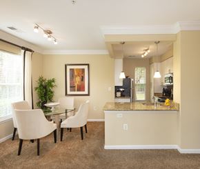 Alexandria apartment for rent - A dining room with a glass table and chairs.