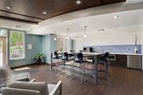 Medford apartment for rent - a room with a large table and chairs and a kitchen in the background