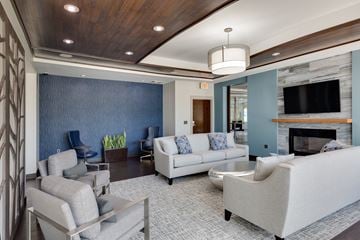 Medford apartment for rent - a living room with couches and chairs and a fireplace
