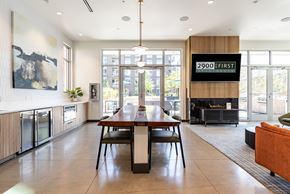 Seattle apartment for rent - A modern kitchen with a dining table and chairs.