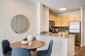 Morristown apartment for rent - a kitchen and dining area with a round table and chairs