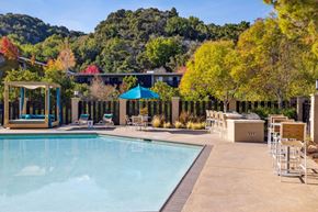 Belmont apartment for rent - A pool area with a mountain in the background.