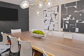 Morristown apartment for rent - a dining room with a wooden table and white chairs