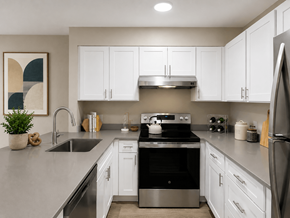 Bellevue apartment for rent - A modern kitchen with white cabinets and stainless steel appliances.