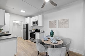 Livermore apartment for rent - A modern kitchen with a dining table set for two.