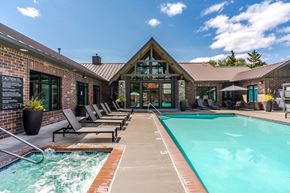 Hillsboro apartment for rent - A pool area with a sign that says "Caution Capacity".