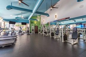 San Diego apartment for rent - a large fitness room with cardio machines and other exercise equipment