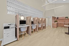 San Diego apartment for rent - A modern office space with wooden furniture and a white printer.