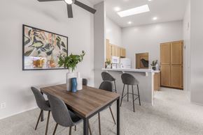 San Diego apartment for rent - A dining area with a wooden table and grey chairs.