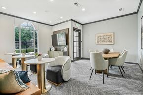 Centennial apartment for rent - A modern dining room with a round table and chairs.
