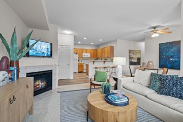 Hillsboro apartment for rent - a living room with a fireplace and a couch