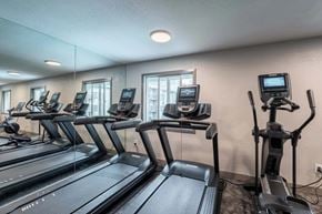 Federal Way apartment for rent - A gym with treadmills and elliptical machines.