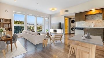 Los Angeles apartment for rent - A modern kitchen and living room with a dining table and chairs.