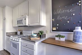 Thousand Oaks apartment for rent - a white kitchen with a chalkboard and a stove