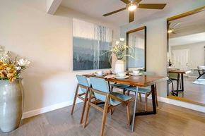 San Jose apartment for rent - a dining room with a wooden table and chairs
