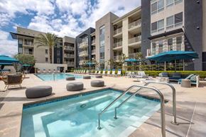 Woodland Hills apartment for rent - a swimming pool with a building in the background