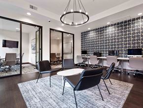 San Jose apartment for rent - a conference room with desks and chairs and a rug