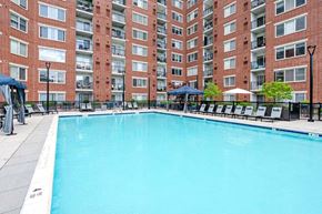 Stamford apartment for rent - a swimming pool in front of an apartment building