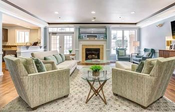 Resident club room w/ wifi, cozy fireplace & demonstration kitchen