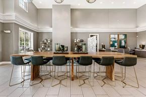 Centennial apartment for rent - a dining room with a wooden table and chairs