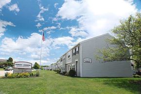 Columbus apartment for rent - a building with an flag in front of it