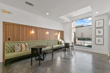 Farmers Branch apartment for rent - a living room with a couch and a table in front of a window
