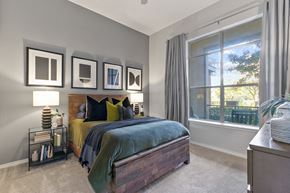 Farmers Branch apartment for rent - a bedroom with a bed and a large window