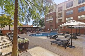 Farmers Branch apartment for rent - our apartments have a large pool and lounge chairs