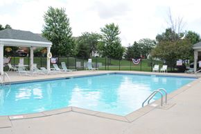 Richwood apartment for rent - A pool with a gazebo and chairs around it at The Legends at Steeplechase Apartments, Richwood, KY