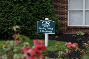 Richwood apartment for rent - A sign for a leasing office and clubhouse is in front of a building at The Legends at Steeplechase Apartments, Richwood, Kentucky