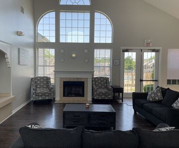 Cincinnati apartment for rent - A living room with a fireplace and two chairs.