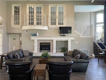 Cincinnati apartment for rent - A living room with a fireplace and a television.