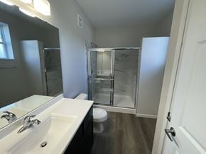 Hebron townhouse for rent - A bathroom with a white sink and a walk-in shower at Hamlet On The Bend, Hebrun, 41048